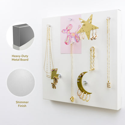 Jewelry organizer suspending necklaces, bracelets, rings, and earrings from strong magnets made into decorative shapes. Pearl shimmer decorative board finish